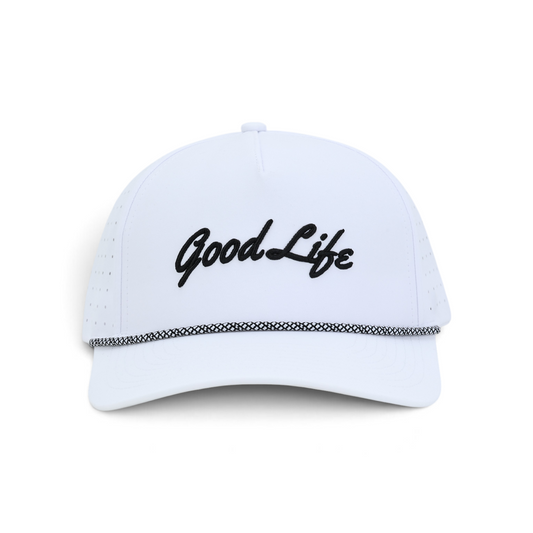 A white snapback cap with 'Good Life' embroidered in black script across the front, featuring a black and white patterned trim along the brim, set against a plain white background.