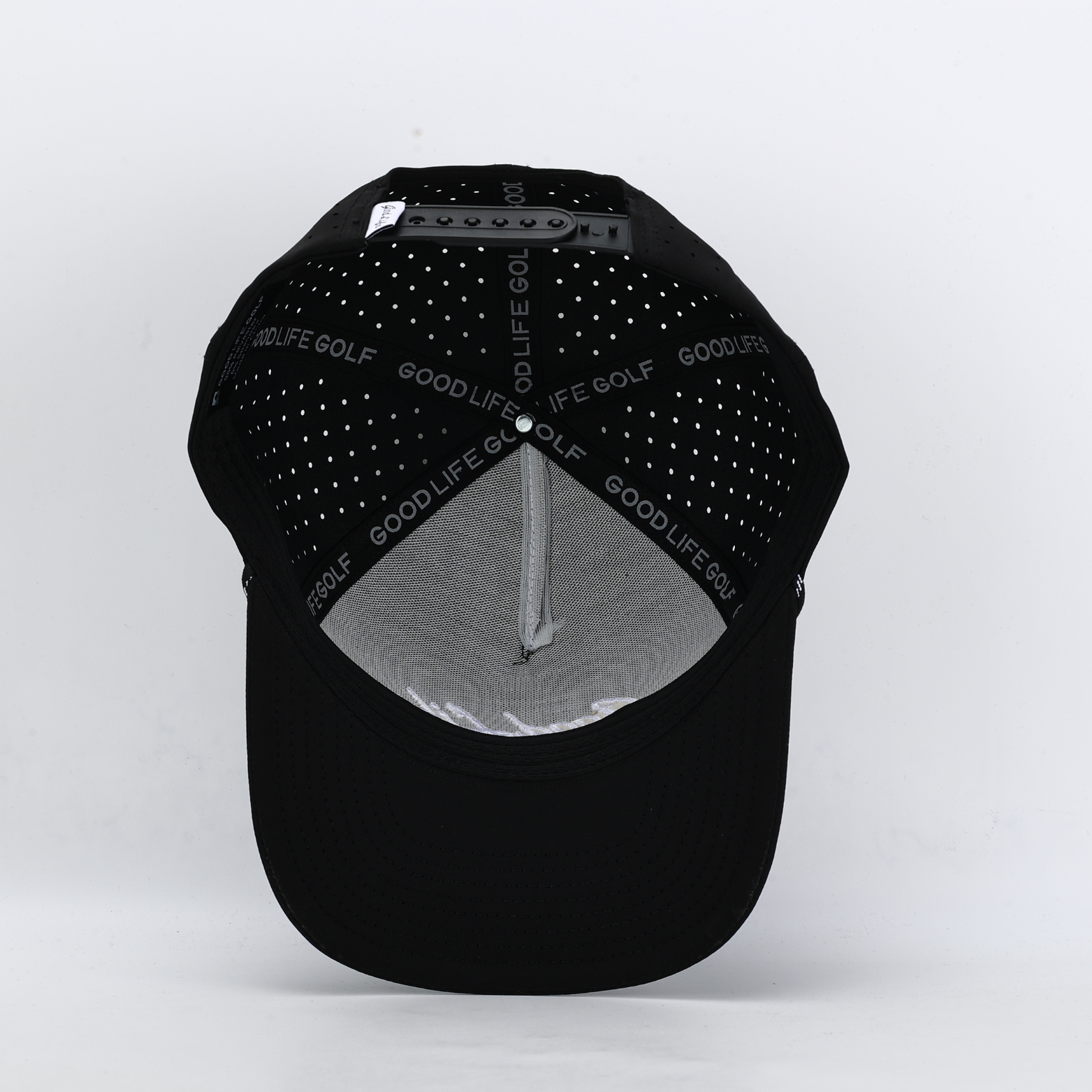 Black cap with studded design on a white background